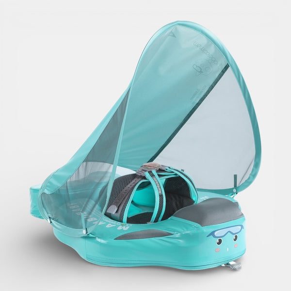 Happy baby in Mambobaby Deluxe Puffer foam float with UPF 50 canopy, non-inflatable safety buckle, soft swimsuit fabric.