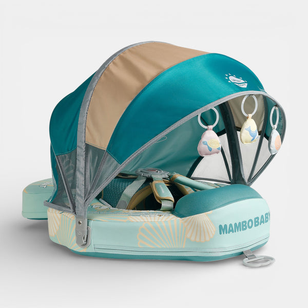Mambobaby float with canopy and tail seashell in aqua, non-inflatable PearlFoam seat on grass.